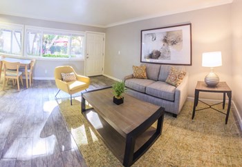 Living Room with a couch, coffee table, and chairs